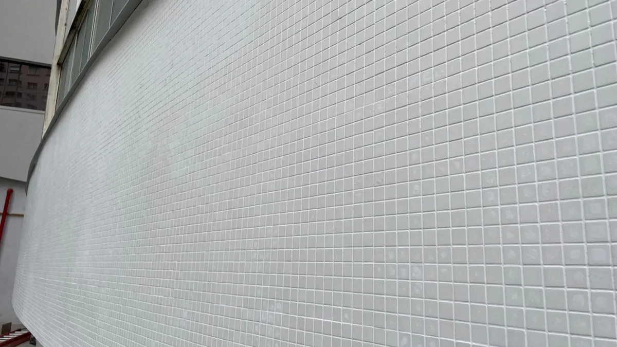 Close-up of the renovated tiled façade