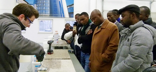 The African guests showed great interest in the product demonstration illustrating industrial floor coatings provided in the MC Events and Training Centre on Müllerstrasse in Bottrop. <br>&copy; MC-Bauchemie 2016